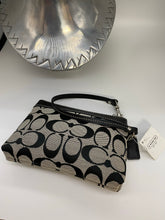 Load image into Gallery viewer, Coach signature wristlet NWT
